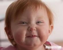 redhead baby smiling