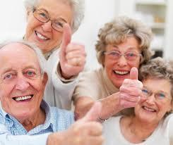 a group of elderly with good teeth